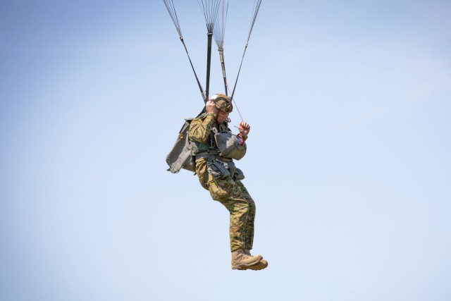 U.S. Army and International Paratroopers conduct a static line Airborne jump using their MC-6 parachutes out of a Ch-47 Chinook Helicopter during Leapfest at Glen Rock Drop Zone, Exeter, Rhode Island, August 2, 2025. All competing Paratroopers use...