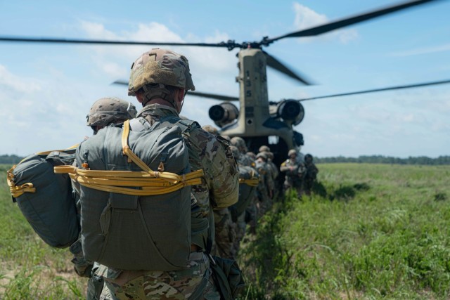 Paratroopers from the 82nd Airborne Division move to board a CH-47 Chinook for Operation Gator Drop at St. Mere Eglise Drop Zone on Fort Bragg, North Carolina, June 17, 2025. Operation Gator Drop was an airborne operation where Paratroopers exited...