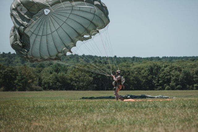 U.S. Army Paratroopers assigned to 982nd Combat Camera Company (Airborne) document U.S. Army, Air Force and International Paratroopers conducting foreign wing static line jumps from a CH-47 Chinook helicopter onto Glen Rock Drop Zone during...