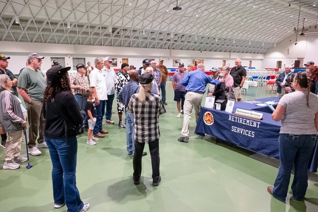 During Retiree Appreciation Days 2024, retirees gather at Nutter Field House for a guided tour of the installation.