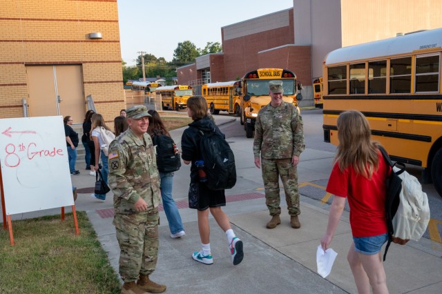 Maj. Gen. Christopher Beck, Fort Leonard Wood and Maneuver Support Center of Excellence commanding general (right), and U.S. Army Engineer School Command Sgt. Maj. David Palmer (left), welcome students to the first day of classes Aug. 18 at...