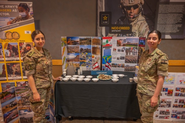 Fort Leonard Wood international military students 1st Lt. Yara Ghazal and 1st Lt. Cynthia Haydamous with the Lebanese army, stand in front of their informational booth Aug. 20, as part of a prelude to the Know Your World event scheduled for 6 to 8...