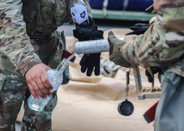 Purified water is poured into a bottle during a water purification training as part of Ulchi Freedom Shield on Anyang Base in Anyang-si, South Korea, Aug. 19, 2025. ...