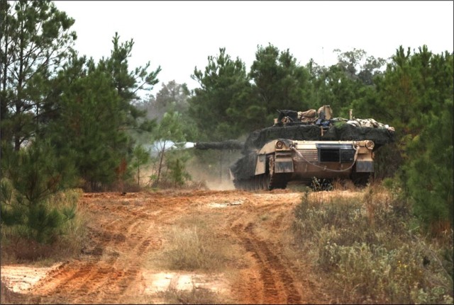 An M1A2 Abrams tank engages enemy armor from the opposing force during JRTC Rotation 25-02. (Photo courtesy of Joint Readiness Training Center)