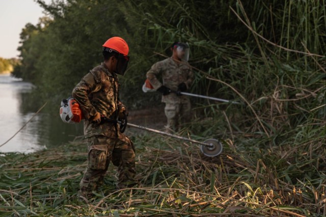 U.S. Soldiers conduct brush clearing operations to support U.S. Border Patrol