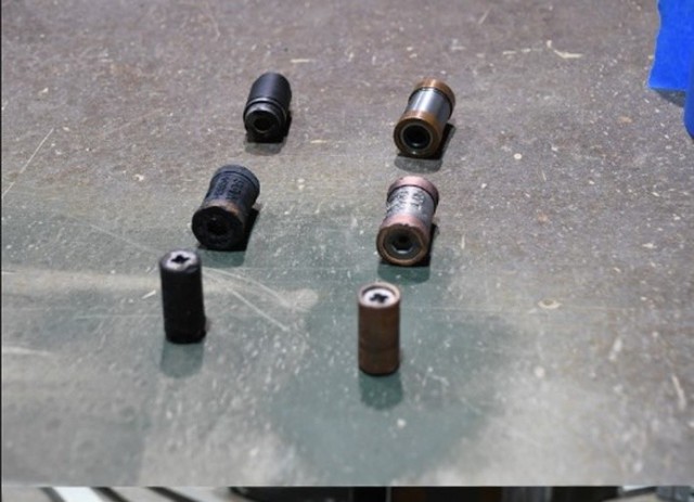 Laser Ablation Cleaning System uses laser light to remove corrosion and deposits from copper crusher gauges and other materials. The photo shows the copper crusher gauges and a piece of metal which have been cleaned with the system.