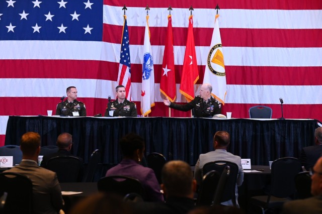 U.S. Army Cols. Steve Winkleman and Peter Sittenauer and Lt. Col. Wes Chaney, regional operations directors at the U.S. Army Security Assistance Command, conduct an RO update at a North Alabama International Trade Association Foreign Military...