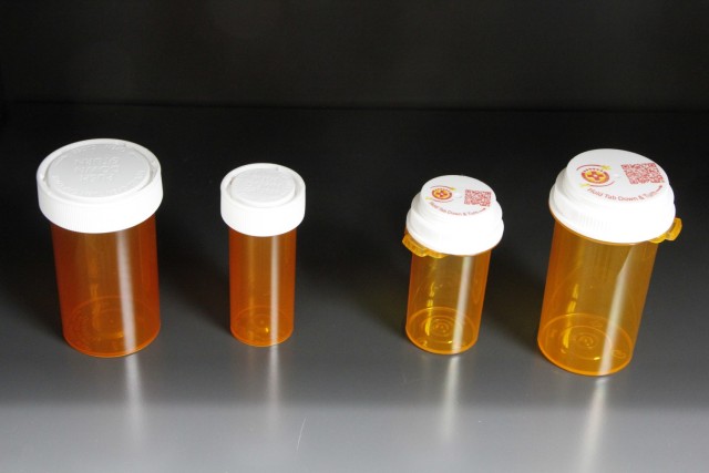 On the right are the prescription bottles with the new printed lid that replaced the older style on the left.