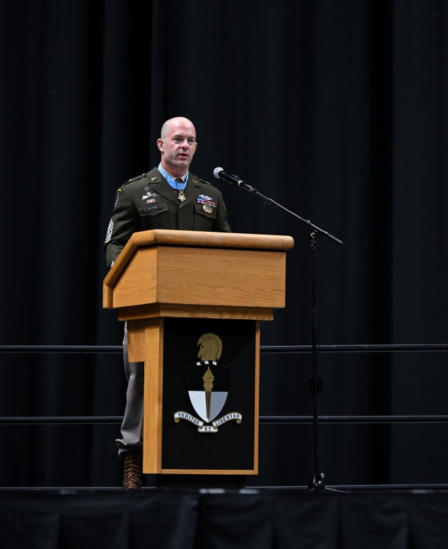 Command Sgt. Maj. Matthew O. Williams. Medal of Honor recipient, U.S. Army John F. Kennedy Special Warfare Center and School, delivers a key-note speech during a graduation ceremony and Regimental First Formation at the Crown Coliseum in...