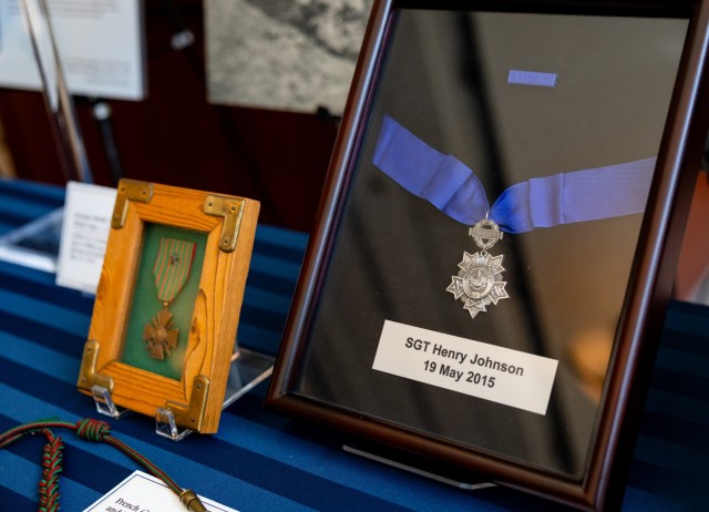 Artifacts on display, including Sgt. Henry Johnson's Medal of Honor, on display before a ceremony honoring the Army’s World War I 369th Infantry Regiment, the “Harlem Hellfighters,” in Emancipation Hall at the U.S. Capitol, September 3,...