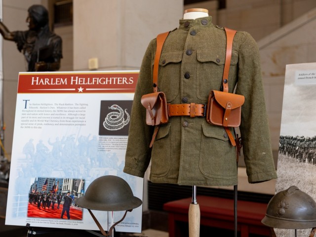 Artifacts on display, including a World War I-era U.S. Army uniform, on display before a ceremony honoring the Army’s World War I 369th Infantry Regiment, the “Harlem Hellfighters,” in Emancipation Hall at the U.S. Capitol, September 3,...