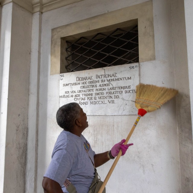A member of the Vicenza military community cleans the...