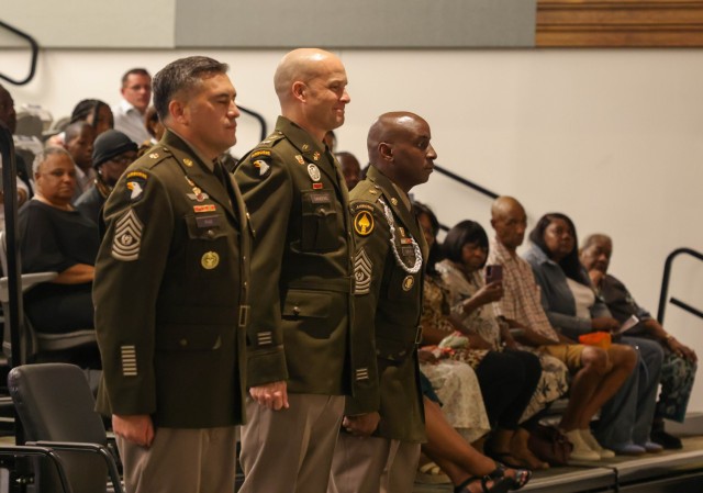(L-R) Incoming 21st Theater Signal Brigade Command Sergeant Major Cesar Ruiz, Colonel John Sanders, and outgoing Command Sgt. Maj. Thomas Bray stand at attention during the Brigade&#39;s change of responsibility ceremony Friday, Sept. 5, 2025.