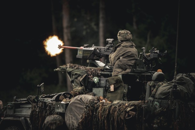 A Dutch soldier assigned to the 17th Light Armored Battalion provides suppressive fire during Exercise Saber Junction 25 at the Hohenfels Training Area, Joint Multinational Readiness Center, Germany, Sept. 5, 2025.