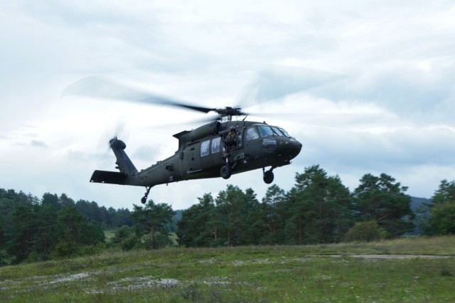 An Army pilot assigned to Task Force Desert Knight conducts a landing during Exercise Saber Junction 25 at the Hohenfels Training Area, Joint Multinational Readiness Center, Germany, Sept. 5, 2025. Saber Junction 25 ensures that U.S., allied and...