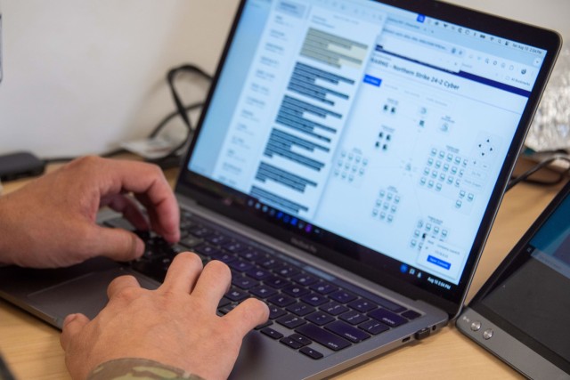 A member of the Michigan Army National Guard Cyber Protection Team 172 types on their laptop during Exercise Northern Strike 24-2 at Alpena Combat Readiness Training Center, Michigan, Aug. 12, 2024. Northern Strike 24-2, one of the Department of...