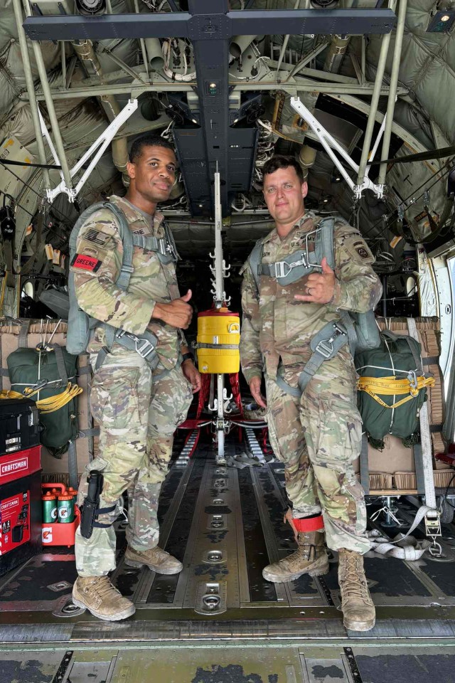 Army Staff Sgt. Darren Greene, left, is pictured with another soldier at Fort Bragg, N.C, in June 2025, preparing for a jump.