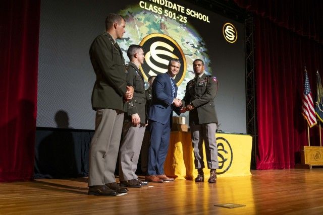 Army 2nd Lt. Darren Greene, right, receives his gold second lieutenant bars from Secretary of War Pete Hegseth at a commissioning ceremony at Fort Benning, Ga., Sept. 4, 2025.