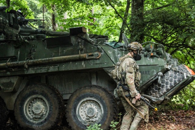 A Soldier from the headquarters element of 1st Cavalry Squadron, 2nd Cavalry Regiment, reacts to a simulated chemical attack at the Joint Multinational Training Center (JMRC) Hohenfels, Germany Sept. 10, 2025. The unit was being targeted by...