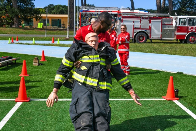 In commemoration of the 9/11/2001 attacks, the USAG-Italy Fire Department hosted a public Firefighter Challenge. This event includes a series of physical challenges, including a charged hose pull, a dummy drag, a Keiser sled, and a tire flip. The...