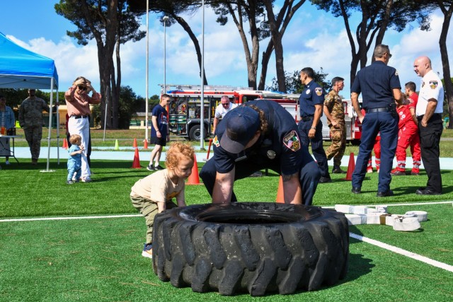 In commemoration of the 9/11/2001 attacks, the USAG-Italy Fire Department hosted a public Firefighter Challenge. This event includes a series of physical challenges, including a charged hose pull, a dummy drag, a Keiser sled, and a tire flip. The...