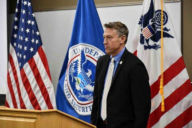 Commissioner prepares to speak