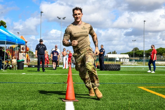 In commemoration of the 9/11/2001 attacks, the USAG-Italy Fire Department hosted a public Firefighter Challenge. This event includes a series of physical challenges, including a charged hose pull, a dummy drag, a Keiser sled, and a tire flip. The...