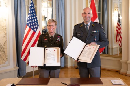 U.S. Army Maj. Gen. Laura Clellan, adjutant general of Colorado, and Lt. Gen. Thomas Süssli, chief of the Swiss Armed Forces, sign a letter of intent for the new National Guard Bureau State Partnership Program between Switzerland and Colorado.