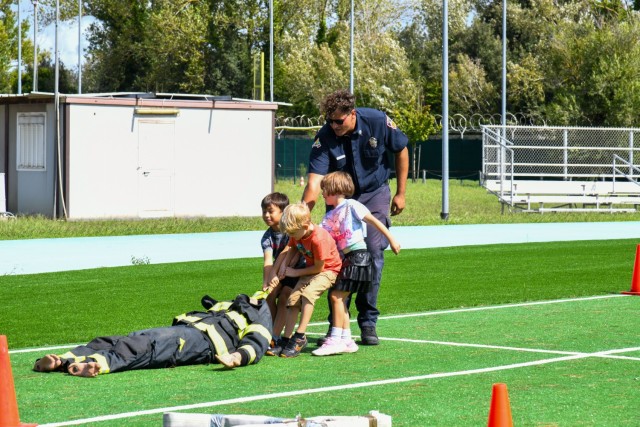In commemoration of the 9/11/2001 attacks, the USAG-Italy Fire Department hosted a public Firefighter Challenge. This event includes a series of physical challenges, including a charged hose pull, a dummy drag, a Keiser sled, and a tire flip. The...