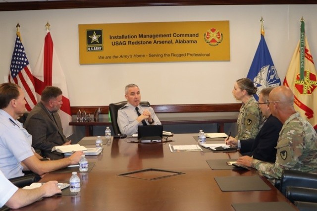 Space Force Gen. Stephen Whiting, commander of Space Command, talks with Garrison Commander Col. Erin Eike during an office visit Sept. 9 at Garrison headquarters.
