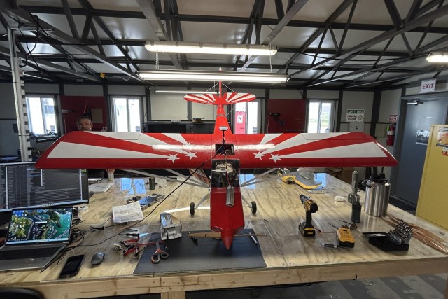 Staff at the Joint Counter-small Unmanned Aircraft Systems University at Fort Sill, Okla., work to program a Super Decathlon unmanned aerial system that's used as a loitering munition at the school, Aug. 19, 2025.