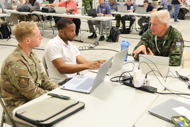 National Guard Soldiers, Airmen, and members of the Virginia Defense Force partner with military and civilian cyber operators in enclaves to simulate the process they would follow to respond to and mitigate a cyber attack. This simulation took...