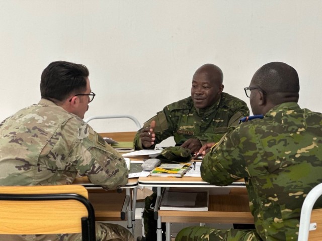 SETAF-AF civil affairs noncommissioned officer translates French for his team in West Africa