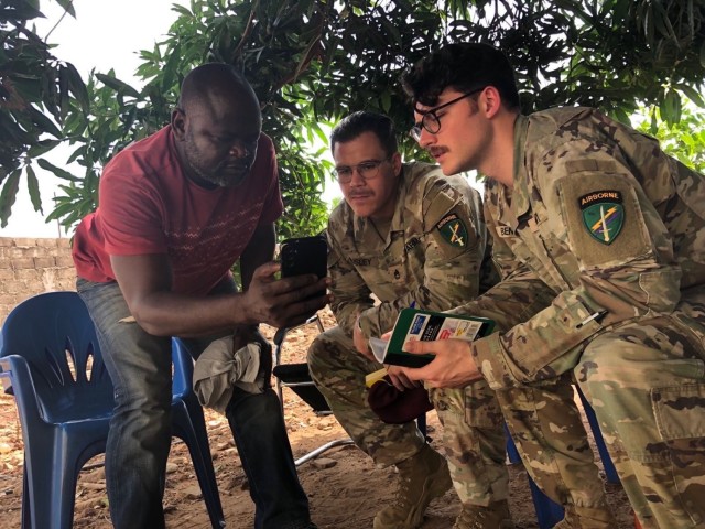 SETAF-AF civil affairs noncommissioned officer translates French for his team in West Africa