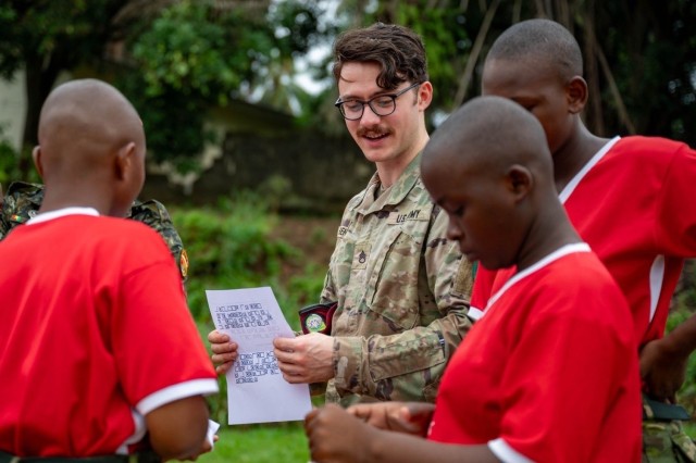 SETAF-AF civil affairs noncommissioned officer translates French for his team in West Africa