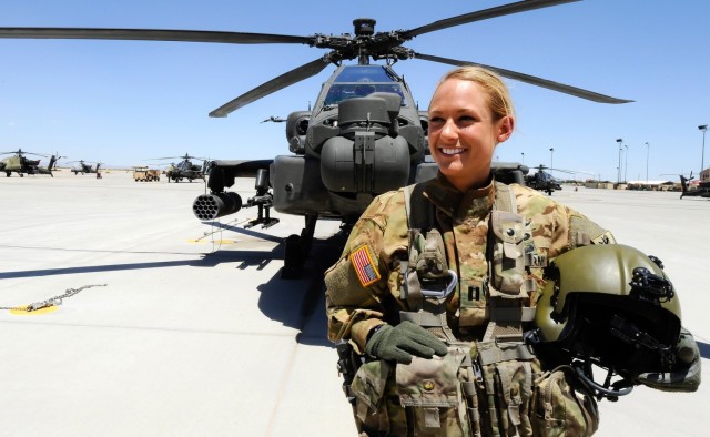 Then-Capt. Lindsey Danilack, poses in front of an AH-64 Apache helicopter at Fort Bliss, Texas. She later became the first woman to pilot the MH-6 Little Bird  Now Lindsey Chrismon, she has left the Army and serves as CEO of venture backed...