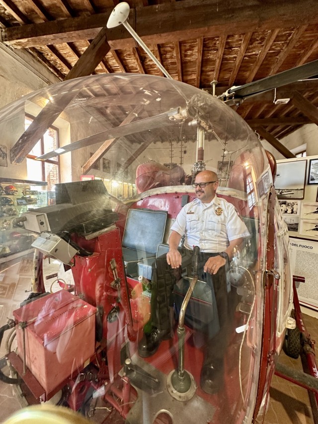 Assistant chief of operations Fernando Carrasco, U.S. Army Garrison Italy, Directorate of Emergency Services, explores a 1956 rescue helicopter during a visit to the Italian National Historical Museum of the Firefighters in Mantua, Italy, on Sept....