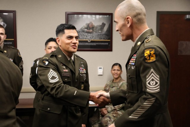 Sgt. 1st Class John Ortega, a talent manager assigned to U.S. Army Human Resources Command is congratulated by U.S. Army Cadet Command Command Sgt. Maj. Darrell Walls after winning the HRC Noncommissioned Officer of the Year competition. The...