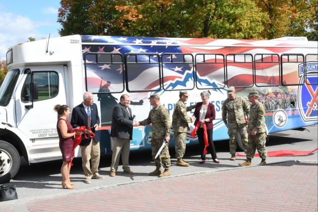 Fort Drum, Lewis County officials, recognize Alpine Express transit service with ribbon-cutting