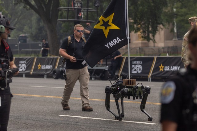 A robotic quadruped unit from Ghost Robotics carries a U.S. Army flag while being remotely operated during the Army’s 250th birthday celebration in Washington, D.C., June 14, 2025. The demonstration highlighted the Army’s continued exploration...