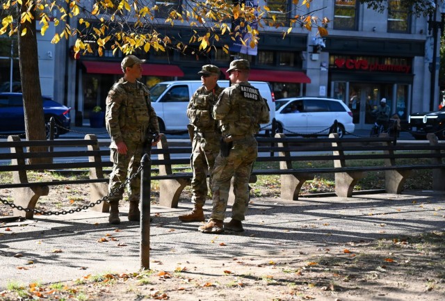 U.S. Air Force Tech. Sgt. Andrew Enriquez, a public affairs specialist with the 113th Wing, District of Columbia Air National Guard, meets with U.S. Army Spc. Ayden Holbert and Pfc. Daniel Tippett, both with the West Virginia National Guard,...