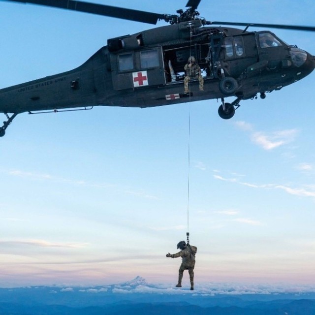 A UH-60L Black Hawk assigned to the U.S. Army Air Ambulance Detachment-Yakima, 2-158 Assault Helicopter Battalion, 16th Combat Aviation Brigade, hovers near the summit of Mount Adams, Wash. during a mission to rescue a hypothermic patient, May...