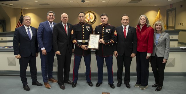 From left - Commissioner Thomas Mastrangelo, Deputy Director Stephen Shaw, Commissioner John Krickus, Staff Sgt. Rafael E. Vallejos, Sgt. Joseph Tortola, Director Tayfun Selen, Commissioners Deborah Smith and Christine Myers.