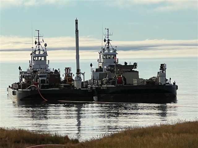 Crowley Tugs & Barges, Sesok/DBL165-1 and Siku/DBL165-2, in Point Lay, Alaska, conducting marine fuel delivery over-the-shore in an austere environment with limited infrastructure.