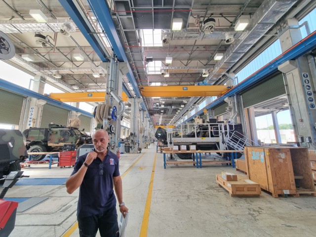 AFSBn-Africa Director of Maintenance Ed Rivera provides a tour of the AFSBn Africa Maintenance Hall at Livorno, Italy, for AFSB Europe BDE and BN Commanders on Aug. 12, 2024.