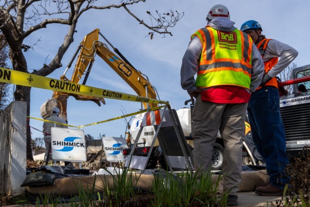 U.S. Army Corps of Engineers personnel coordinate with contractors during debris removal operations at a wildfire-impacted property in Pacific Palisades, Calif. on February 15, 2025. The U.S. Army Corps of Engineers is conducting debris removal...