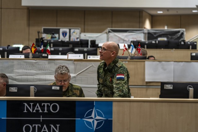 Dutch Army Maj. Jochem van Wijk and Norwegian Army Lt. Col. Terje A. Brokke coordinate operations during Exercise Steadfast Duel 2025 on Lucius D. Clay Kaserne, Germany, Oct. 27, 2025. The exercise fosters close cooperation among NATO Allies in...