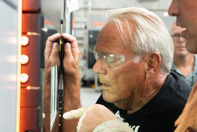 Cliff Voss observes the innovative Additive Manufacturing process at Rock Island Arsenal-Joint Manufacturing and Technology Center. This cutting-edge technology represents a significant advancement in defense manufacturing, showcasing the...