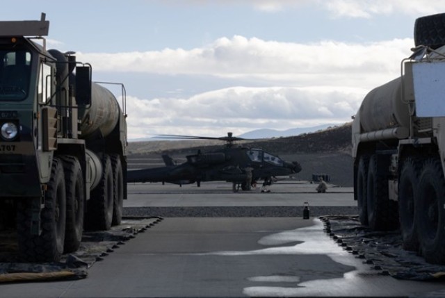 U.S. soldiers assigned to 16th Combat Aviation Brigade, refuel an AH-64 Apache during Rising Thunder 25 at Yakima Training Center, Wash., Nov. 1, 2025. Rising Thunder is designed to enhance interoperability and combat readiness between the U.S....