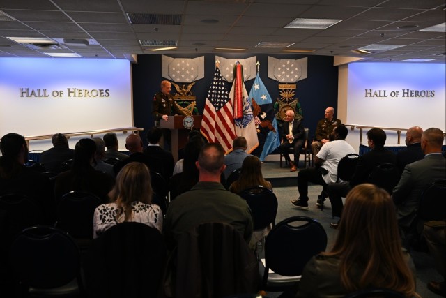 Col. Kevin Bouren, lead for the Army’s Reinstatement and Reconciliation Task Force, speaks during Capt. Mark Bashaw’s reinstatement ceremony in the Hall of Heroes at the Pentagon, Nov. 14, 2025. Bouren outlined the Army’s effort to restore...